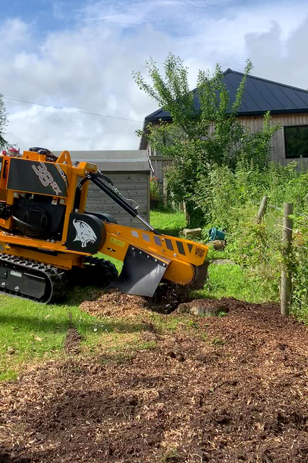 Stump grinding in progress on a Glasgow site